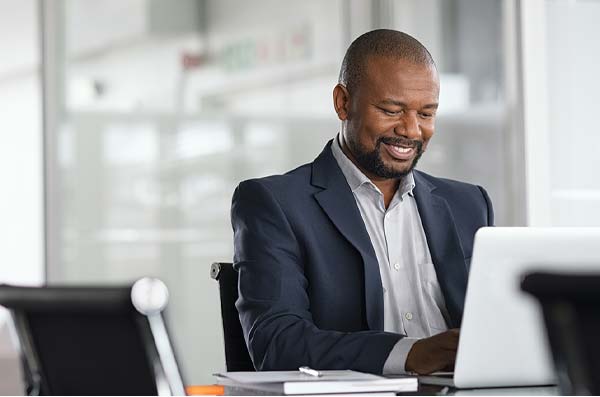 man using Member.Net from work laptop